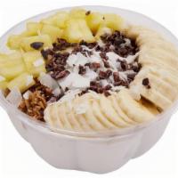 Coco Maui Bowl · Base: White coconut.. Toppings: Pineapple, banana, cacao nibs, almond granola, coconut flakes.