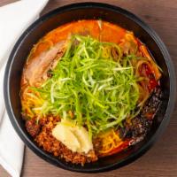 Garlic Bomb Ramen · Fresh and deep-fried garlic, green onions, chashu pork.