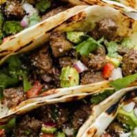 Street Taco · Our street style tacos are made with steak, onion, cilantro, on corn tortillas choice of hot...