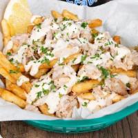 Crab Fries (1/2 Order) · Your choice of cajun or lemon pepper fries topped with real blue crab meat and drizzled with...