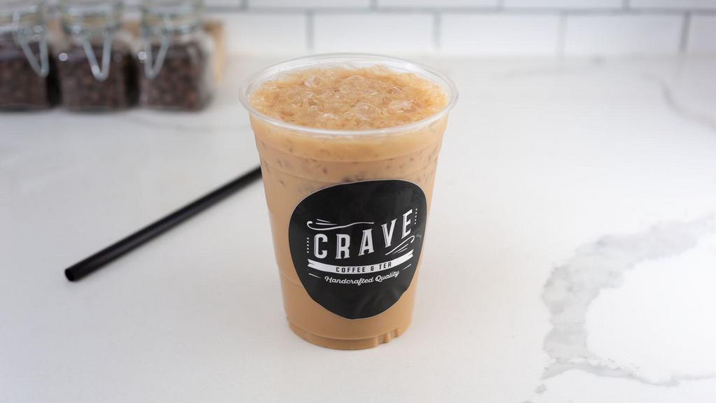 Iced Dirty Chai Tea Latte · Spiced Chai with milk over ice and shots of espresso.