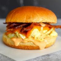 Bacon, Egg And Cheddar Sandwich · 2 fresh cracked cage-free scrambled eggs, melted Cheddar cheese, smokey bacon, and Sriracha ...