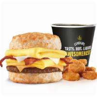 Monster Biscuit® Combo · Crispy bacon, sausage patty, two folded eggs, Swiss & American cheeses on a buttermilk biscu...