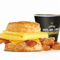 Bacon Egg & Cheese Biscuit Combo · Crispy bacon, folded egg and American cheese on a buttermilk biscuit. Served with Hash Round...