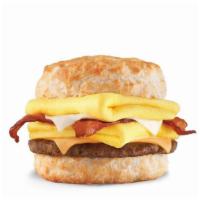 Monster Biscuit® · Crispy bacon, sausage patty, two folded eggs, Swiss & American cheeses on a buttermilk biscu...