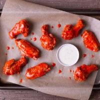 8 Wings · 8 antibiotic-free wings fried to a crisp, with your choice of one flavor.