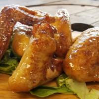 Smoked Wings · Five whole wings smoked to deliciousness and smothered with our special sauce.