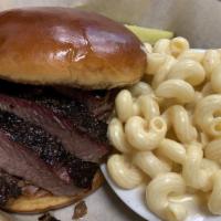 Brisket Sammich · Our multiple Award winning Brisket served on a butter toasted brioche bun served with one si...
