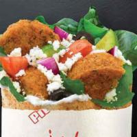 Falafel · Falafel grilled in Secret Sauce topped with Spinach, Tomatoes, Cucumbers, Onions, Black Oliv...