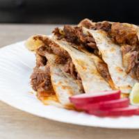 Quesadilla Con Carne · Flour tortilla filled with cheese and your choice of meat.