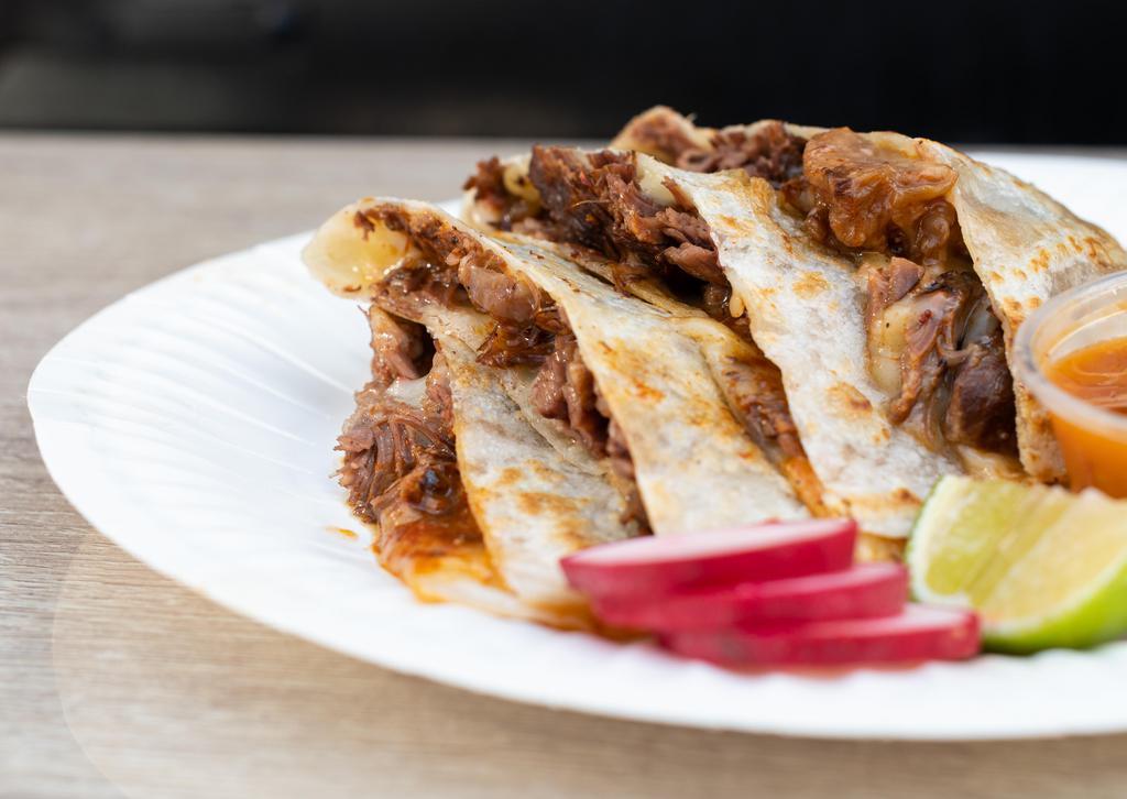 Quesadilla Con Carne · Flour tortilla filled with cheese and your choice of meat.