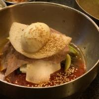 Bibim Naengmyun · cold noodles served with a sweet, spicy, and tangy Korean chili mix paste topped with sliced...