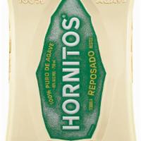 Hornitos Reposado · Pale straw colored with herbal green apple and agave notes.