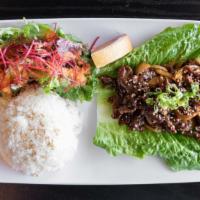 Beef Teriyaki · pan-fried beef with onions; teriyaki sauce. Served with steamed white rice & salad with our ...