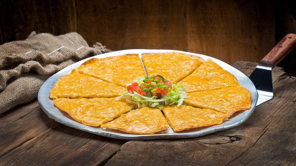Cheese Crisp · Flour tortilla topped with melted cheese.