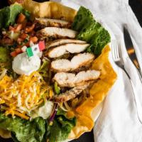 Fajita Salad · Grilled marinated sirloin or chicken breast with grilled peppers and onions on crisp salad g...