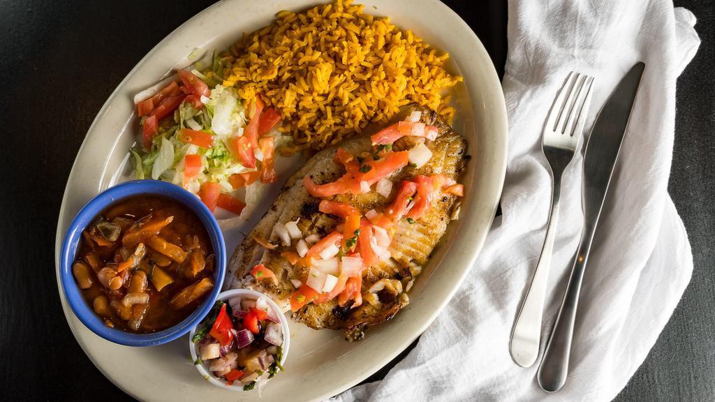 Tilapia Pacifico · Spicy. Spicy seasoned tilapia fillet grilled and topped with fresh salsa de pina made with black beans, pineapple, cilantro, red onion, red bell pepper, and jalapenos. Served with rice and choice of beans.
