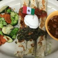 Lite Grilled Chicken Flautas · Charbroiled chicken breast rolled in low-fat flour tortillas and grilled. Topped with tomati...