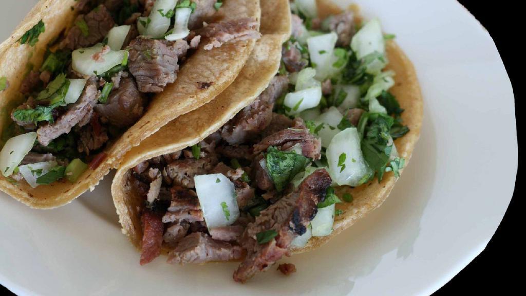 Street Tacos · Beef, chicken or carnitas served open-faced on two corn tortillas. Topped with cilantro, diced red onions and or fresh charred salsa.
