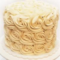Chocolate Vegan Cake · Chocolate vegan cake with vanilla bean frosting with a rosette finish.