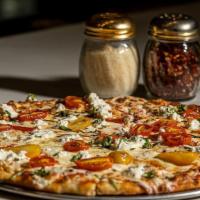 Mediterranean Pizza · Fresh Mozzarella, Feta, Heirloom Tomatoes, Kalamata Olives, Onions”
