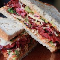Pastrami Sandwich · Homemade Pastrami, Kale Slaw, Pickles on Rye