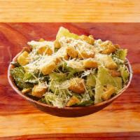 Caesar Salad · Crisp Romaine, gourmet croutons, freshly grated Parmesan cheese with creamy Caesar dressing.