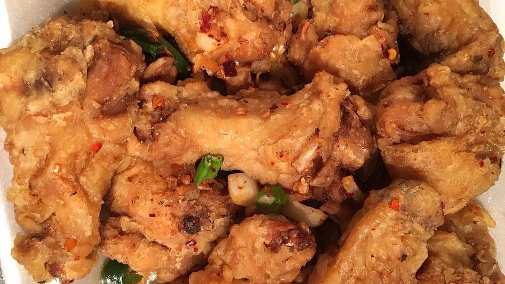 Salted Pepper Chicken Wings · Cooked wing of a chicken coated in sauce or seasoning. hot and spicy.