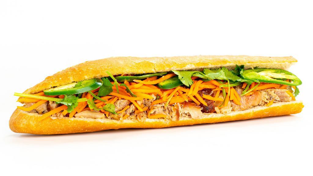 Chicken Sandwich · Juicy, seasoned, shredded grilled chicken, mayo, pickled salad, chili and cilantro in a 12-inch baguette.
