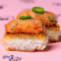 The Original Spicy Tuna Krispy Rice · grilled sushi rice, spicy tuna tartare garnished with serrano peppers (2 pc)
