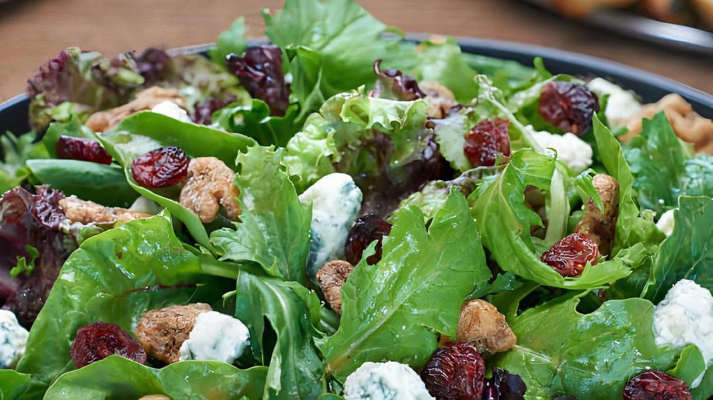 Oh Baby Salad · Spring mix, aged Gorgonzola crumbles, candied walnuts, and dried cranberries with balsamic vinaigrette.