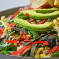 Southwest Chicken Caesar Salad · Romaine lettuce, grilled chicken breast, spicy Caesar dressing, avocado, black bean & corn s...