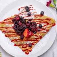 Mixed Berry Crepe · Raspberries, blueberries, blackberries & strawberries topped with raspberry sauce, powder su...