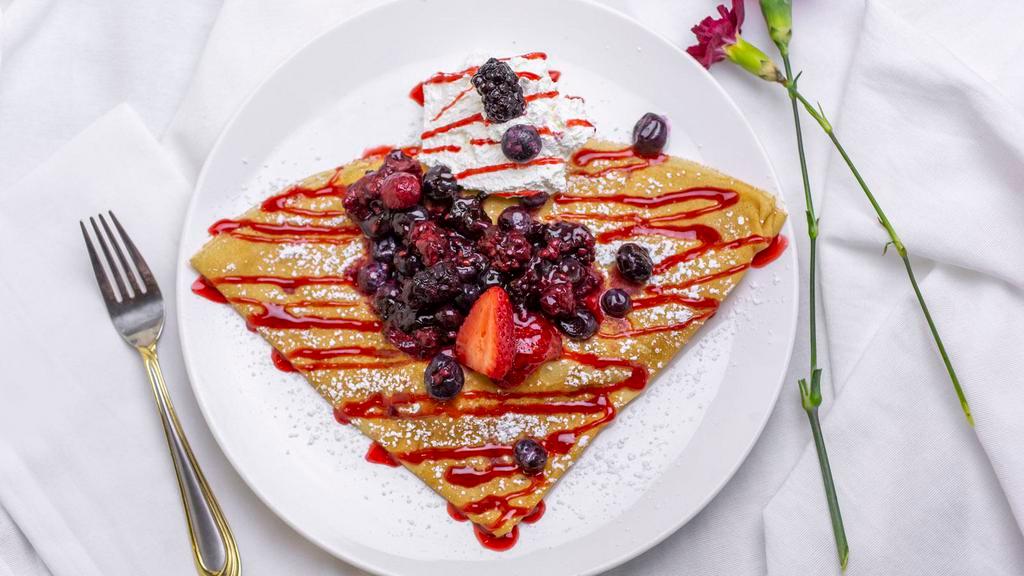 Mixed Berry Crepe · Raspberries, blueberries, blackberries & strawberries topped with raspberry sauce, powder sugar & whipped cream.