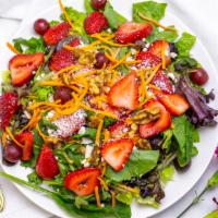 Paris Salad · Field greens, feta cheese, carrots, toasted walnuts, strawberries & grapes w/ raspberry vina...