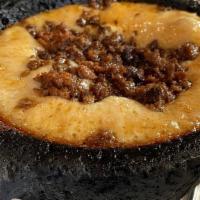 Queso Fundido · Melted cheese with chorizo served with flour tortilla.