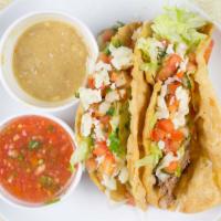 Shredded Beef Tacos (2) · Served with rice, beans and pico de gallo.