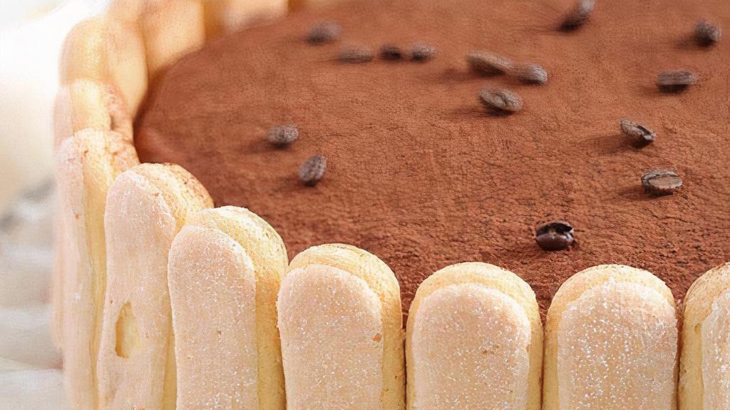 Tiramisu Cake · Tiramisu is a coffee-flavored Italian dessert. It is made of ladyfingers dipped in coffee, layered with a whipped mixture of cream, sugar, and mascarpone cheese, top with cocoa powder.