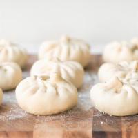 Chicken Steamed Buns · Steamed buns with chicken and veggies.