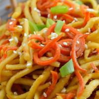 Garlic Noodles · Stir-fried noodles with garlic, carrots, house sauce, topped with parmesan cheese, and with ...