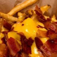Bacon Cheese Fries · Crispy Seasoned Fries With Cheese Cheeses Sauce and Bacon