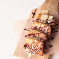 Bread Pudding · White Chocolate Banana Bread Pudding with chocolate sauce and Creme anglaize
