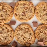 Heathbar Crunch Cookie · Buttery, brown sugar cookie loaded with chocolate chips and toffee bits with thick, chewy ce...