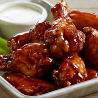 Bone-In Wings · Juicy bone-in wings, perfectly crisp on the outside and tender on the inside. Served with on...