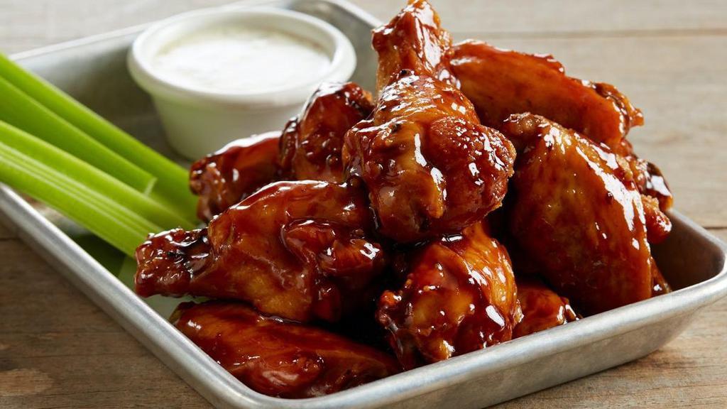 Bone-In Wings · Juicy bone-in wings, perfectly crisp on the outside and tender on the inside. Served with one of our flavor-packed sauces or dry rubs and accompanied by a side of celery sticks and creamy ranch dressing.