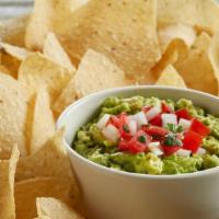 Housemade Guacamole And Chips · Our housemade guacamole is made fresh daily and is filled with chunky avocados, diced jalape...