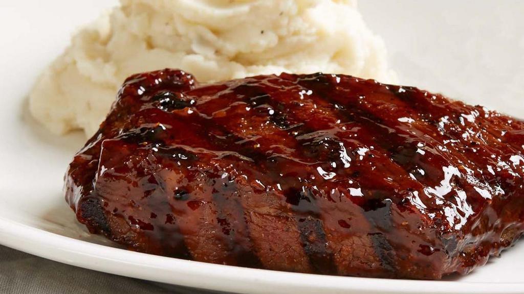 Slow-Roasted Tri-Tip Entree* · 8 oz. of mouthwatering sliced, slow-roasted sirloin tri-tip covered in peppered BBQ sauce and paired with your choice of classic sides.