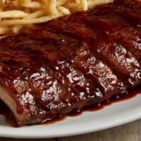 Half Rack Of Baby Back Ribs · Half rack of savory, fall-off-the-bone baby back pork ribs smothered in peppered BBQ sauce. ...