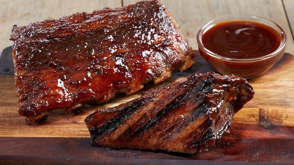 Tri-Tip And Ribs* · 6 oz. of mouthwatering, sliced sirloin tri-tip and a half rack of tender baby back ribs covered in savory peppered BBQ sauce. Served with your choice of classic sides.