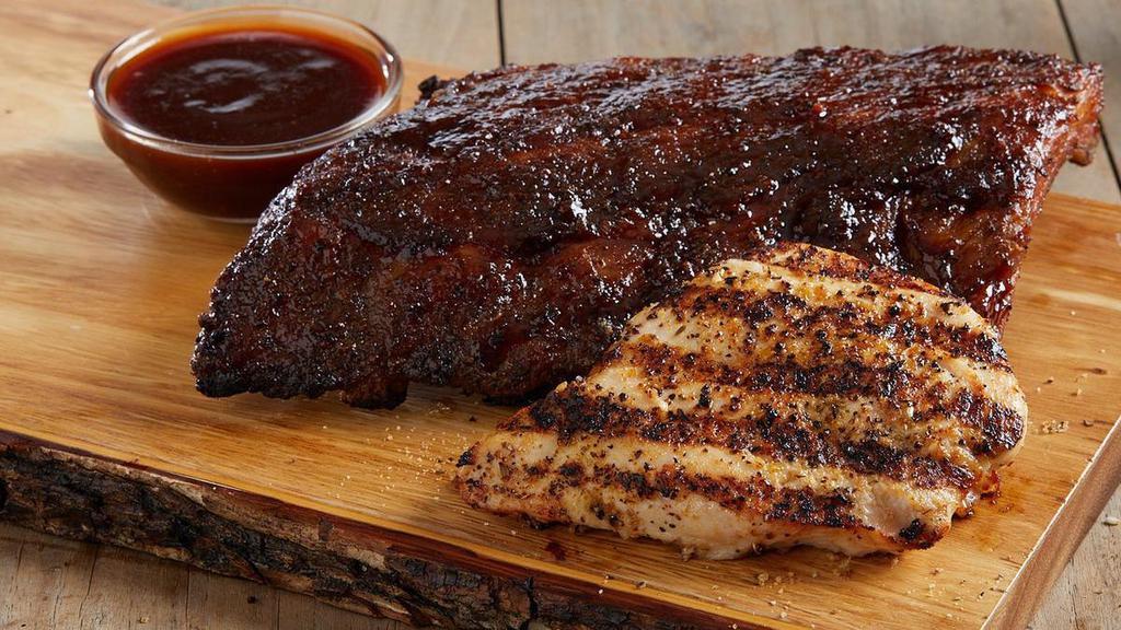 Baby Back Ribs And Chicken · Half rack of tender, fall-off-the bone baby back pork ribs, smothered in tangy peppered BBQ sauce and paired with a juicy, herb-roasted chicken breast. Served with your choice of two classic sides.